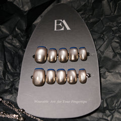 Mercury Edge press-on nail set by Editory — champagne metallic with cobalt blue outline