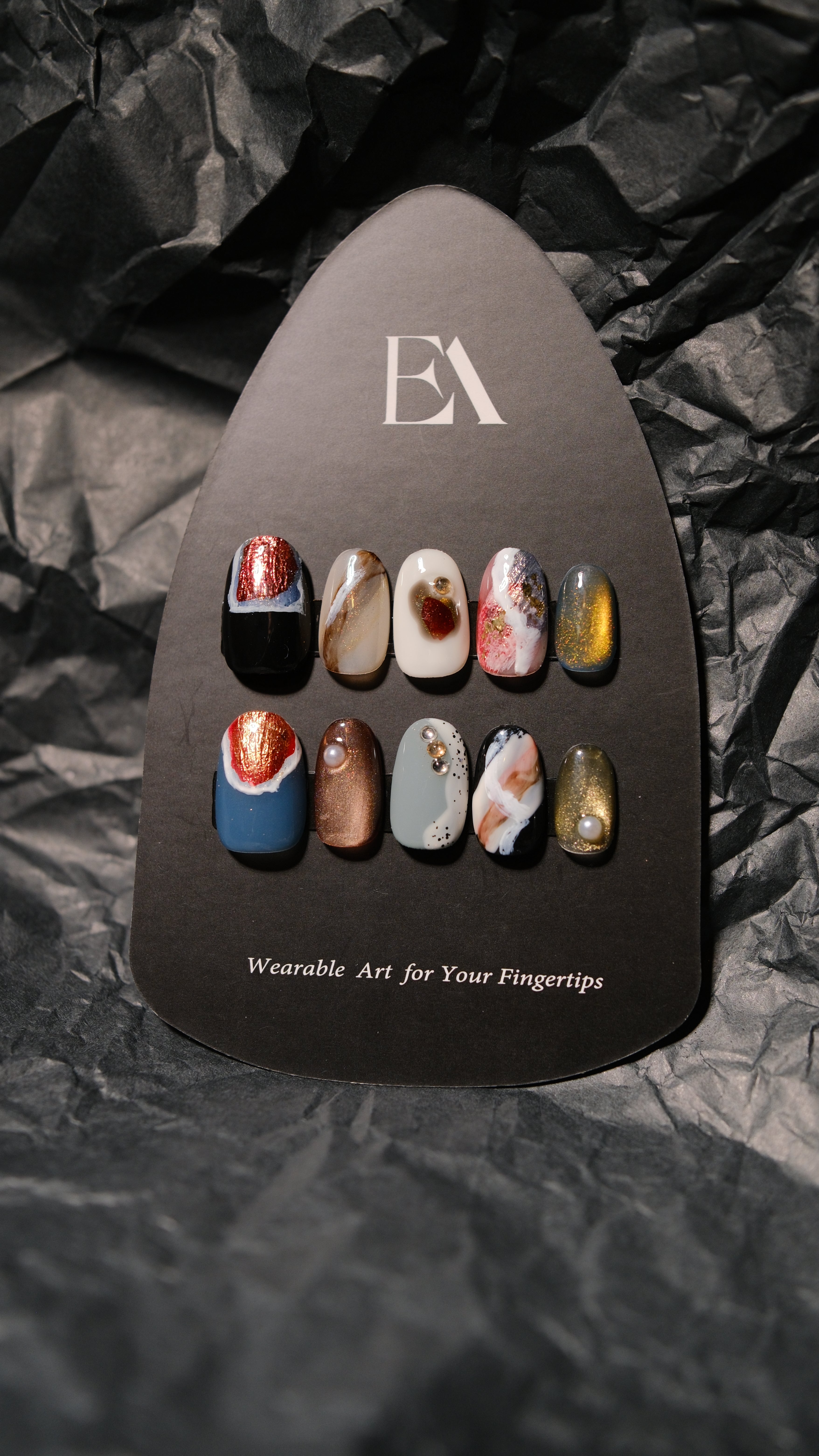 Terra Veil handcrafted press-on nail set by Editory — mixed-mineral finish with garnet glitter and bronze