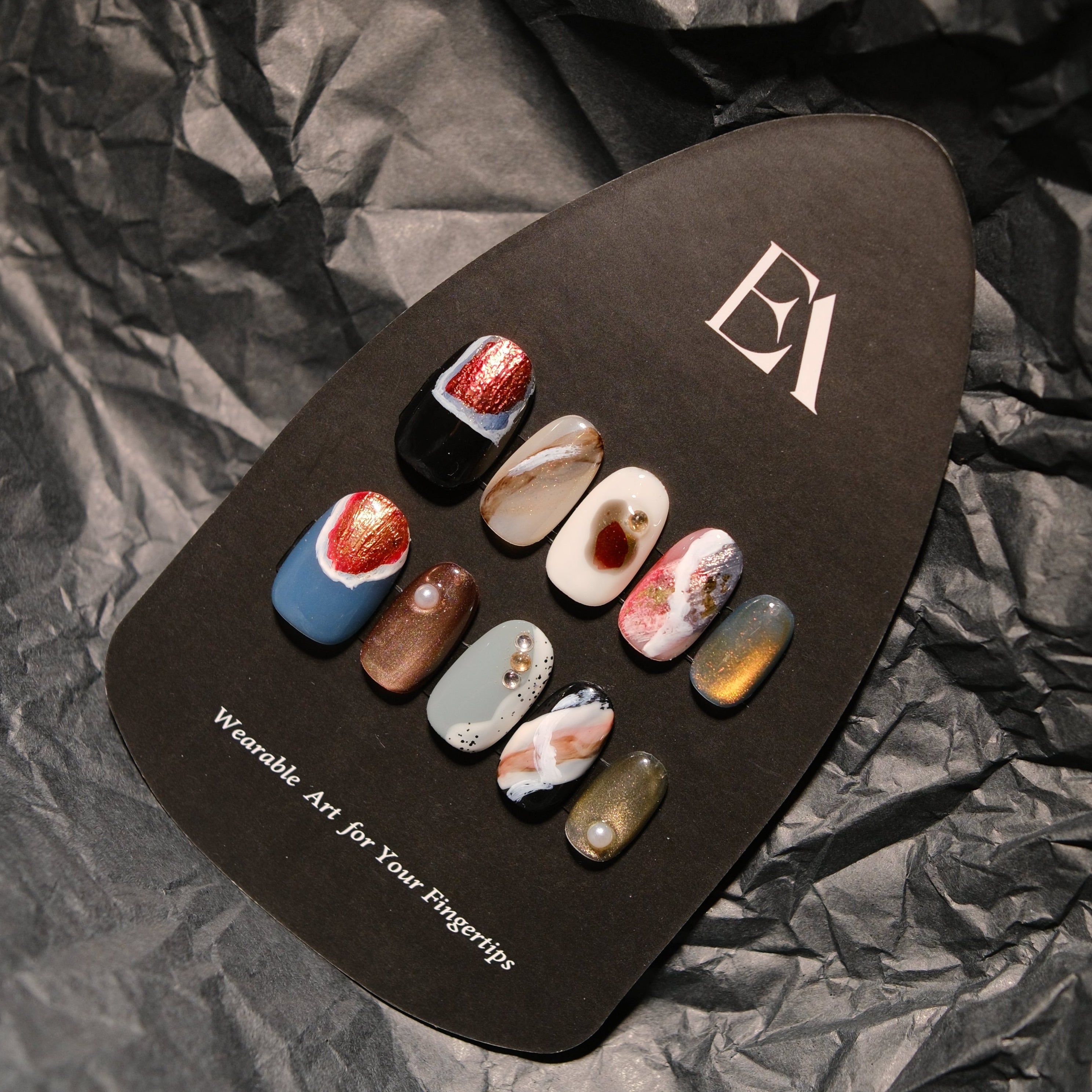 Terra Veil handcrafted press-on nail set by Editory — mixed-mineral finish with garnet glitter and bronze