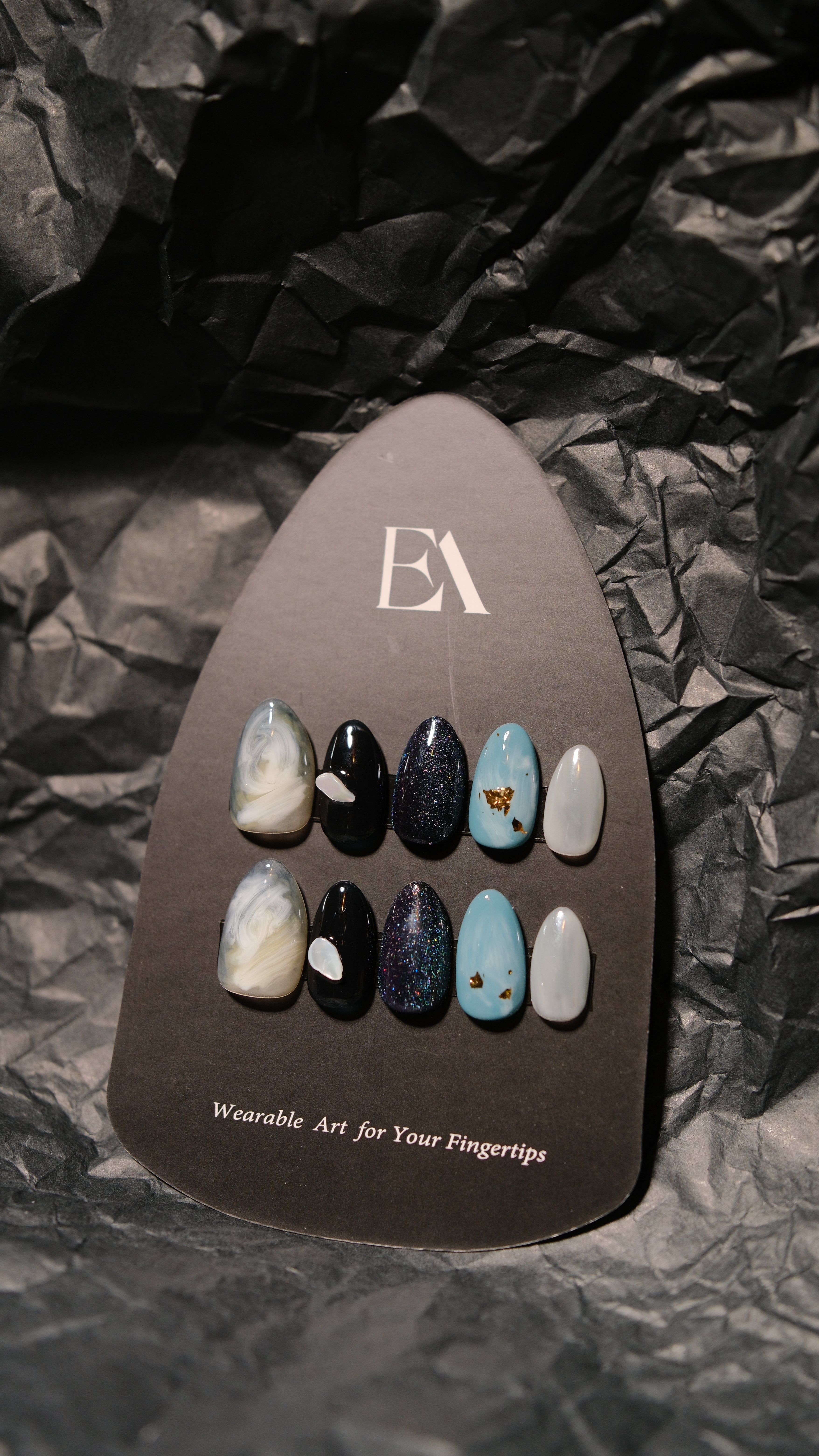 Noir Vein handcrafted press-on nail set by Editory — black marble with stone blue and metallic accents